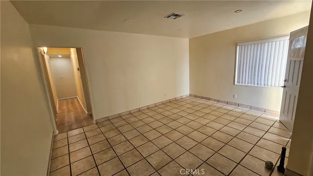 a view of an empty room and window