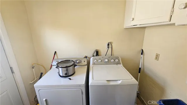 a bathroom with a sink mirror and shower