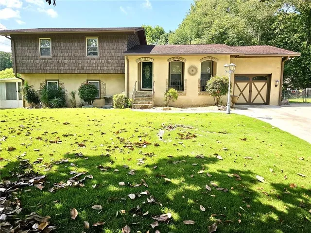 a front view of a house with a yard