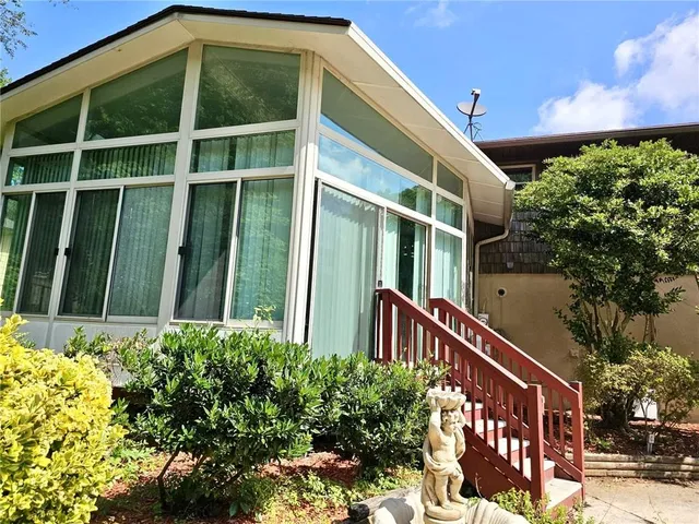 a view of a terrace with a tree