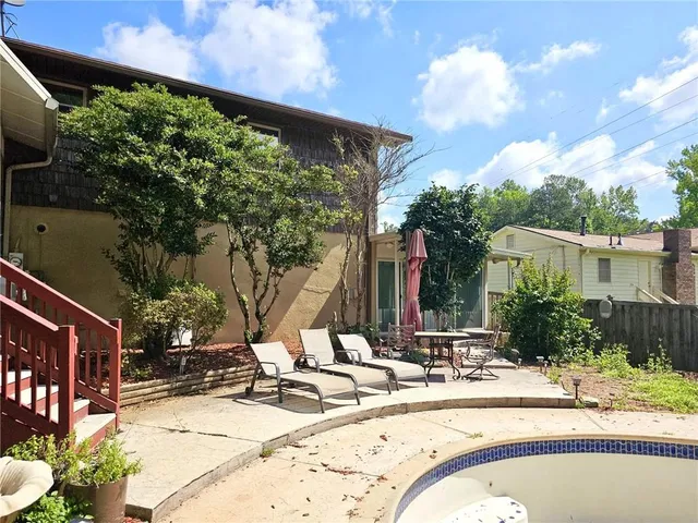 a view of swimming pool with a patio