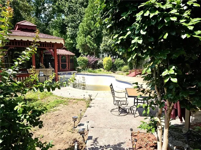 a view of a house with a swimming pool