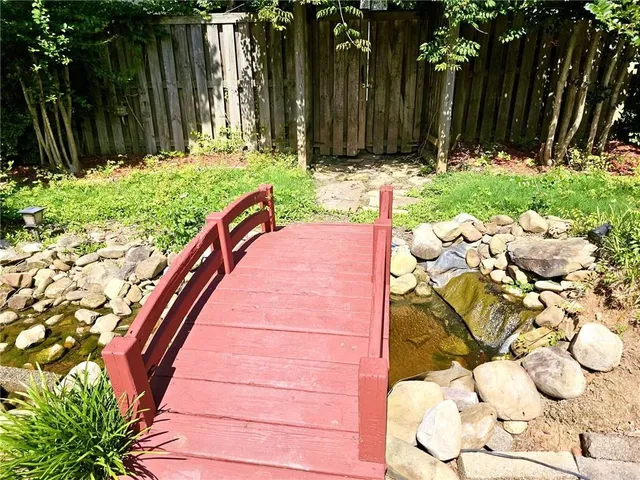 a backyard of a house with green landscape