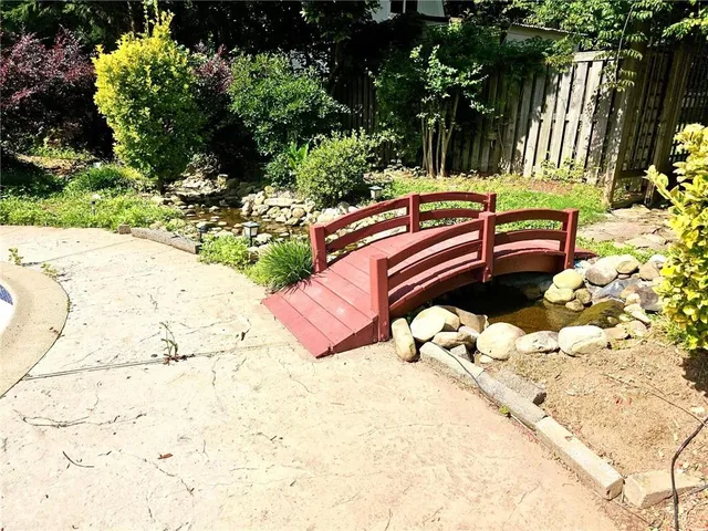 a view of a garden with houses
