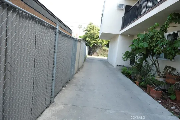 a path view of a house with balcony