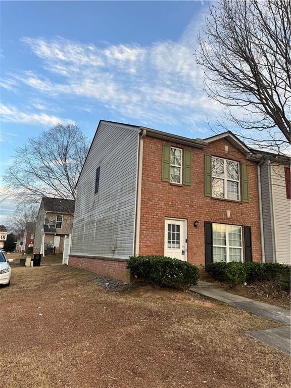 1754 Grove Way Hampton, GA 30228 - Photo 2 of 16 a front view of a house with a yard and garage