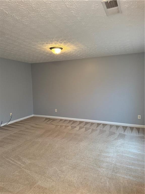 1754 Grove Way Hampton, GA 30228 - Photo 3 of 16 a view of an empty room