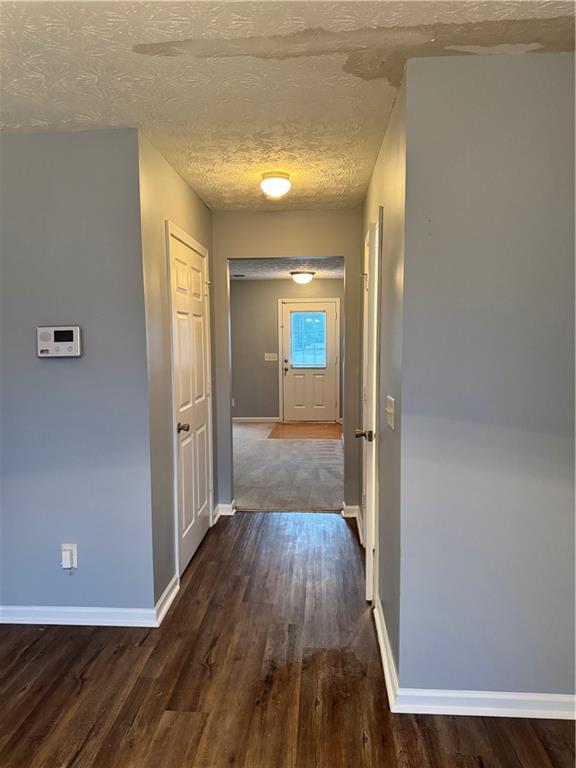 1754 Grove Way Hampton, GA 30228 - Photo 7 of 16 a view of a hallway with wooden floor