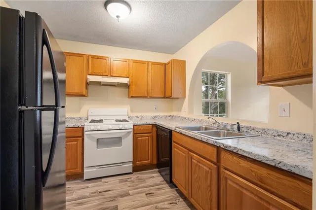 a balcony with wooden floor and fence