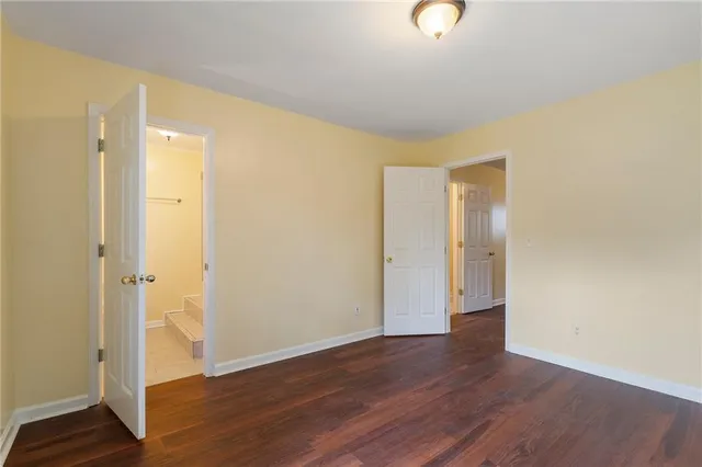 a white toilet sitting next to a bath tub