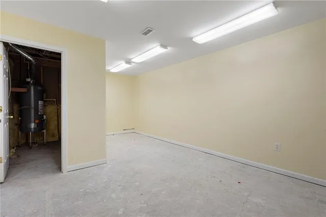 an empty room with a bathroom