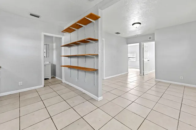 a view of an empty room and window