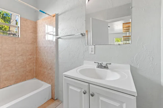 a bathroom with a sink and a bathtub