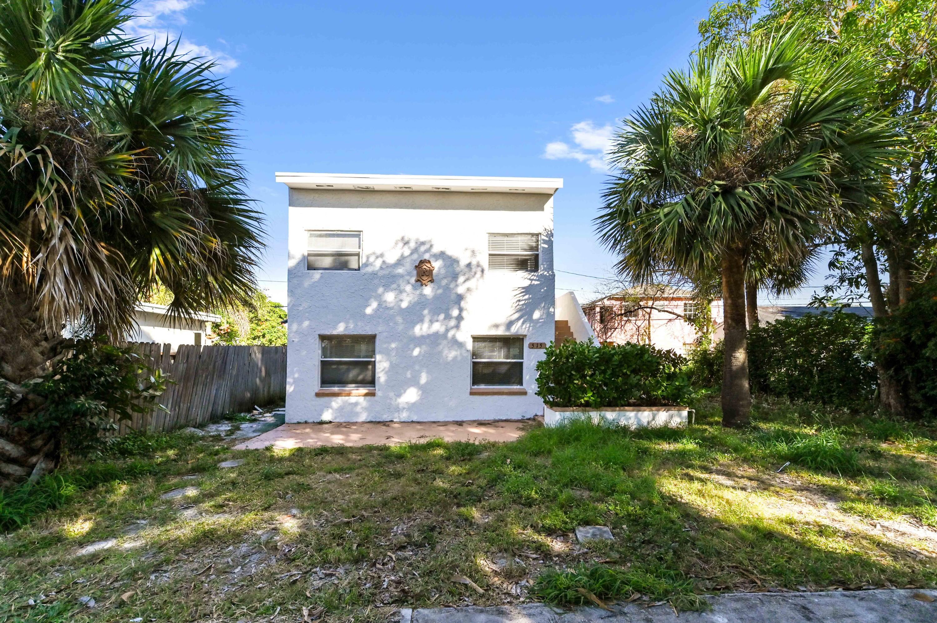 515 Putnam Road West Palm Beach, FL 33405 - Photo 3 of 23 a front view of a house with garden