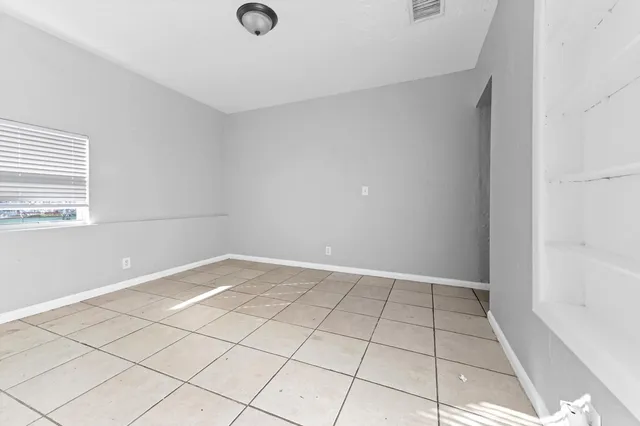 a view of an empty room and window