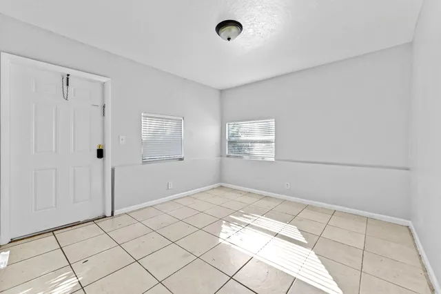 a view of an empty room and window