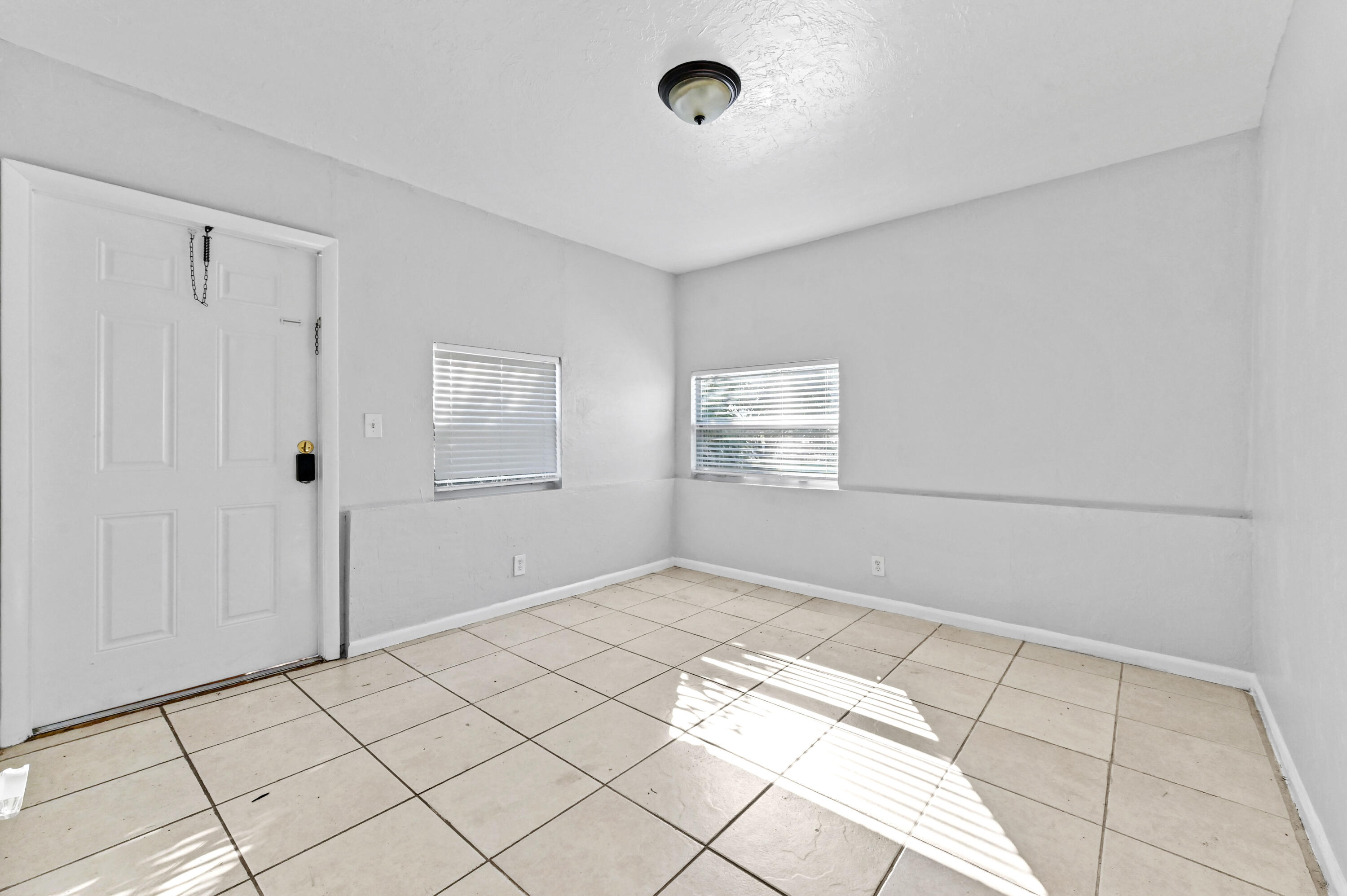 515 Putnam Road West Palm Beach, FL 33405 - Photo 7 of 23 a view of an empty room and window