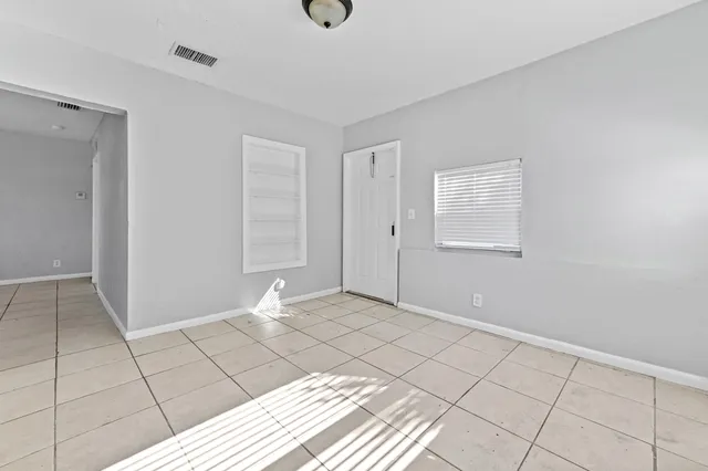 a view of an empty room and window