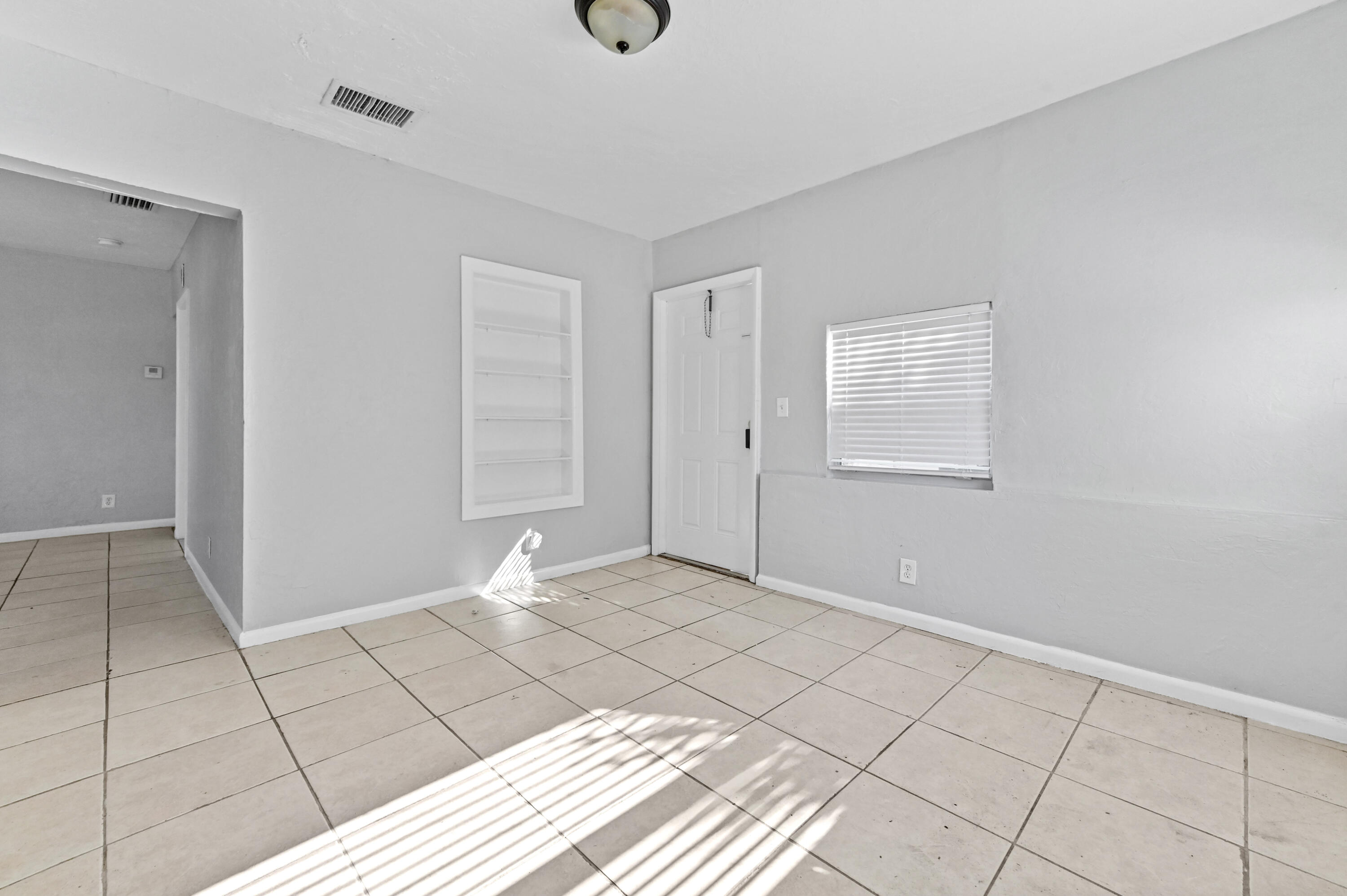 515 Putnam Road West Palm Beach, FL 33405 - Photo 8 of 23 a view of an empty room and window