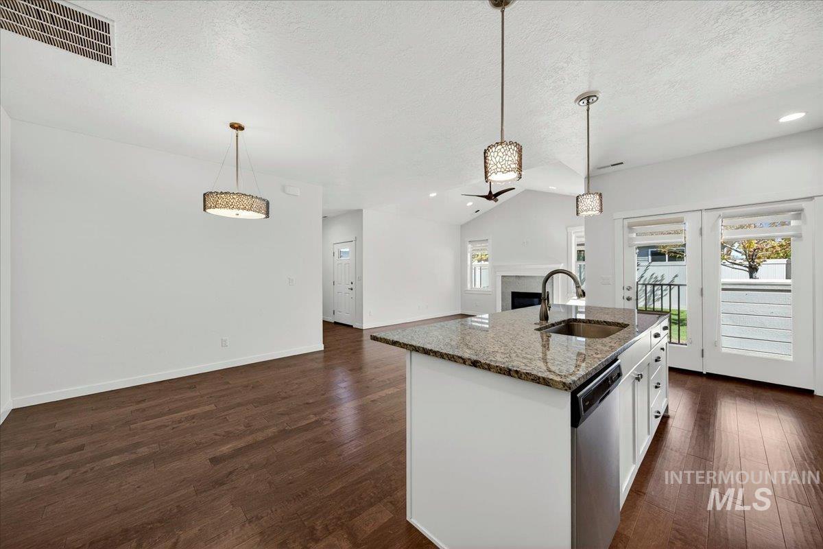 4204 East Silverking Lane Meridian, ID 83642 - Photo 17 of 40 Spacious kitchen island featuring a stone countertop and undermount sink