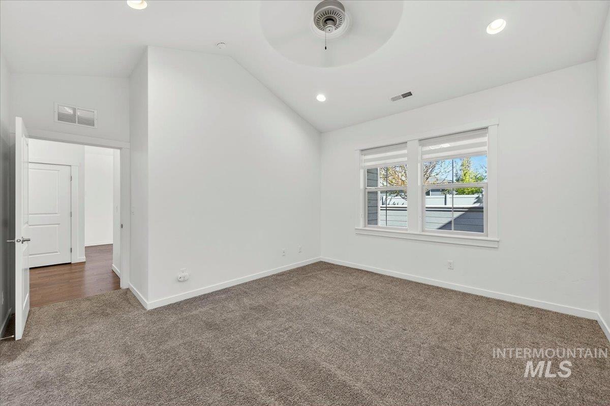 4204 East Silverking Lane Meridian, ID 83642 - Photo 24 of 40 Room featuring a vaulted ceiling with recessed lighting and a ceiling fan