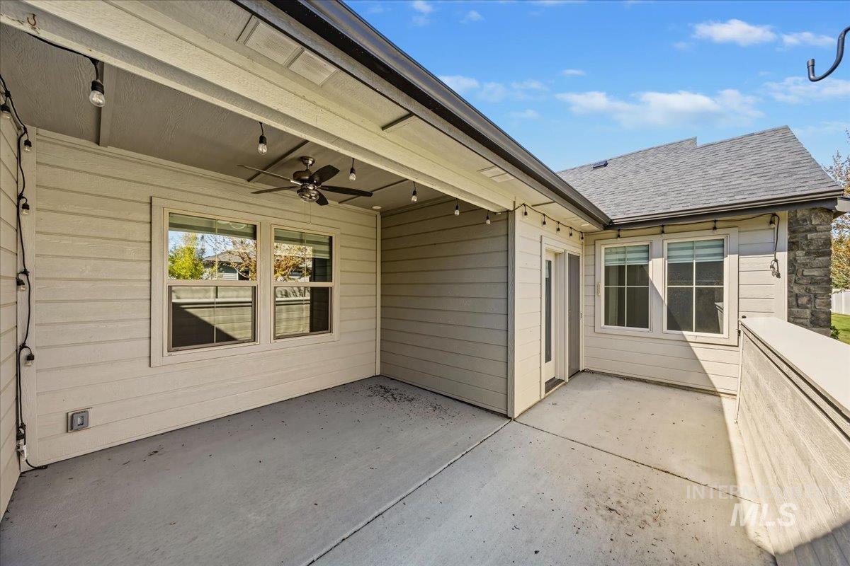 4204 East Silverking Lane Meridian, ID 83642 - Photo 33 of 40 Concrete patio featuring an overhead ceiling fan, string lighting, and direct access to the interior