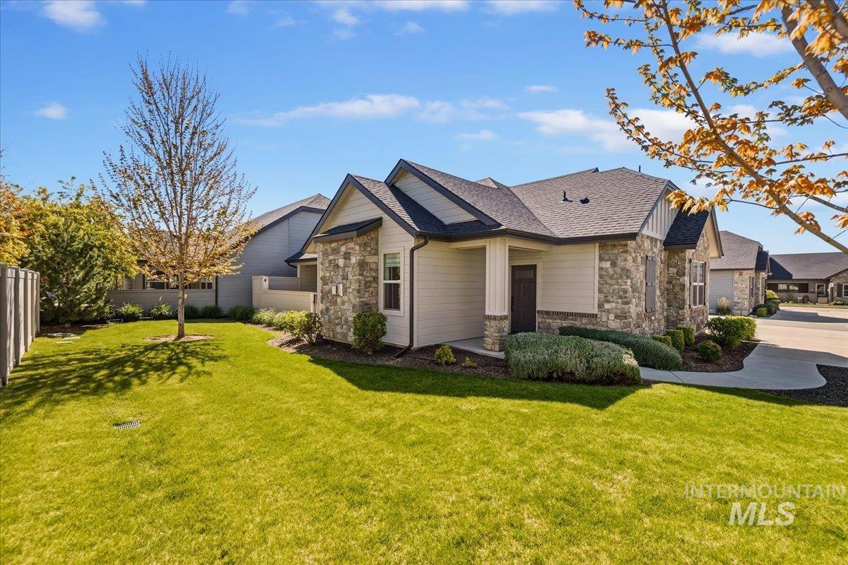 4204 East Silverking Lane Meridian, ID 83642 - Photo 37 of 40 Stone and siding exterior with dark trim accents
