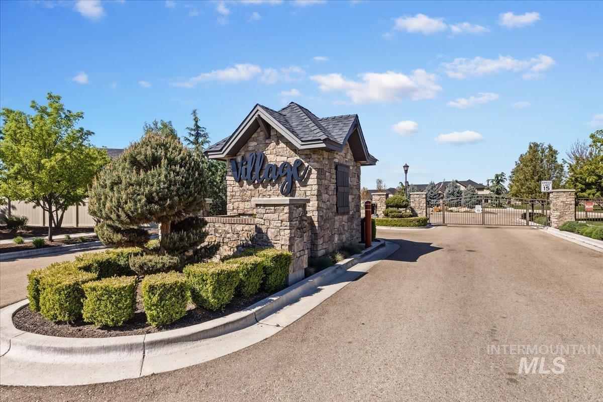 4204 East Silverking Lane Meridian, ID 83642 - Photo 40 of 40 Stone and shingle entrance feature with prominent "Village" signage