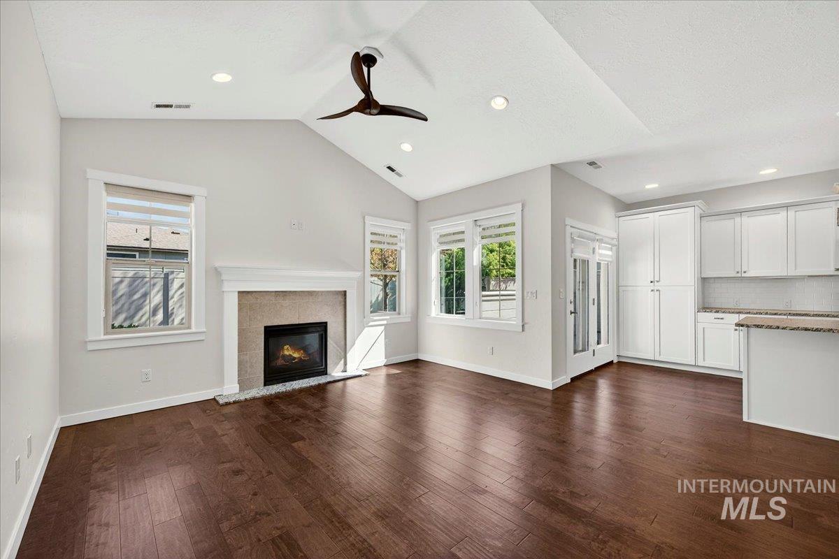 4204 East Silverking Lane Meridian, ID 83642 - Photo 5 of 40 Living area featuring a vaulted ceiling with a ceiling fan, recessed lighting, and wood-finish flooring