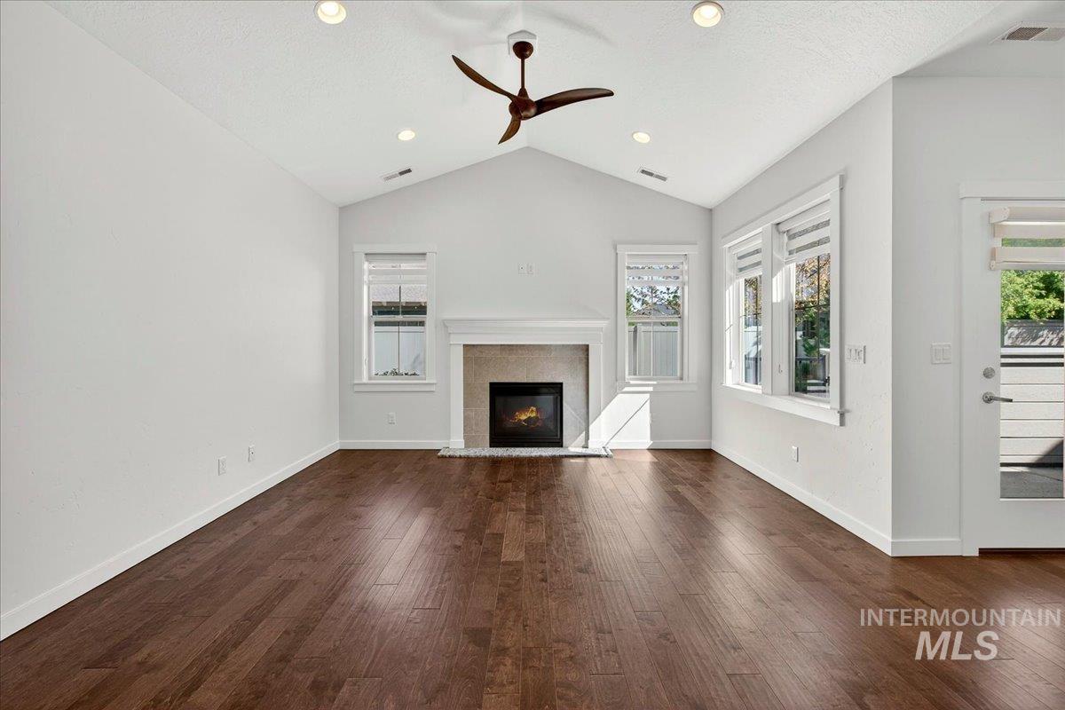 4204 East Silverking Lane Meridian, ID 83642 - Photo 7 of 40 Spacious living area featuring vaulted ceilings, recessed lighting, and rich wood-finish flooring