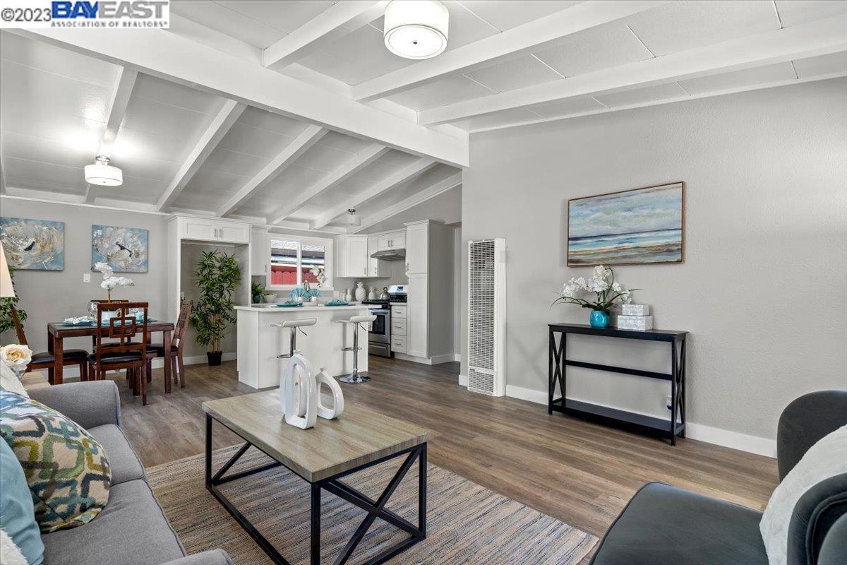 27608 Sebastian Way Hayward, CA 94544 - Photo 1 of 1 a living room with furniture and a wooden floor