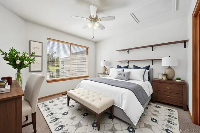 a bedroom with a bed and a table