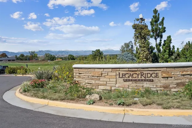 a view of a street with a building in the background