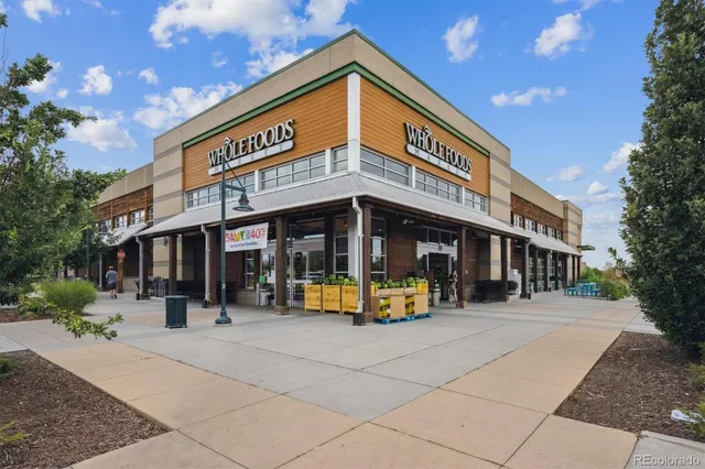 a picture of a bench in middle of a building