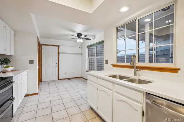a kitchen with a sink and cabinets