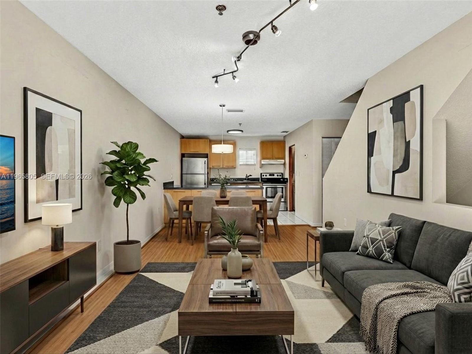 240 Southwest 15th Road, Unit 112 Miami, FL 33129 - Photo 1 of 47 a living room with furniture kitchen view and a large window