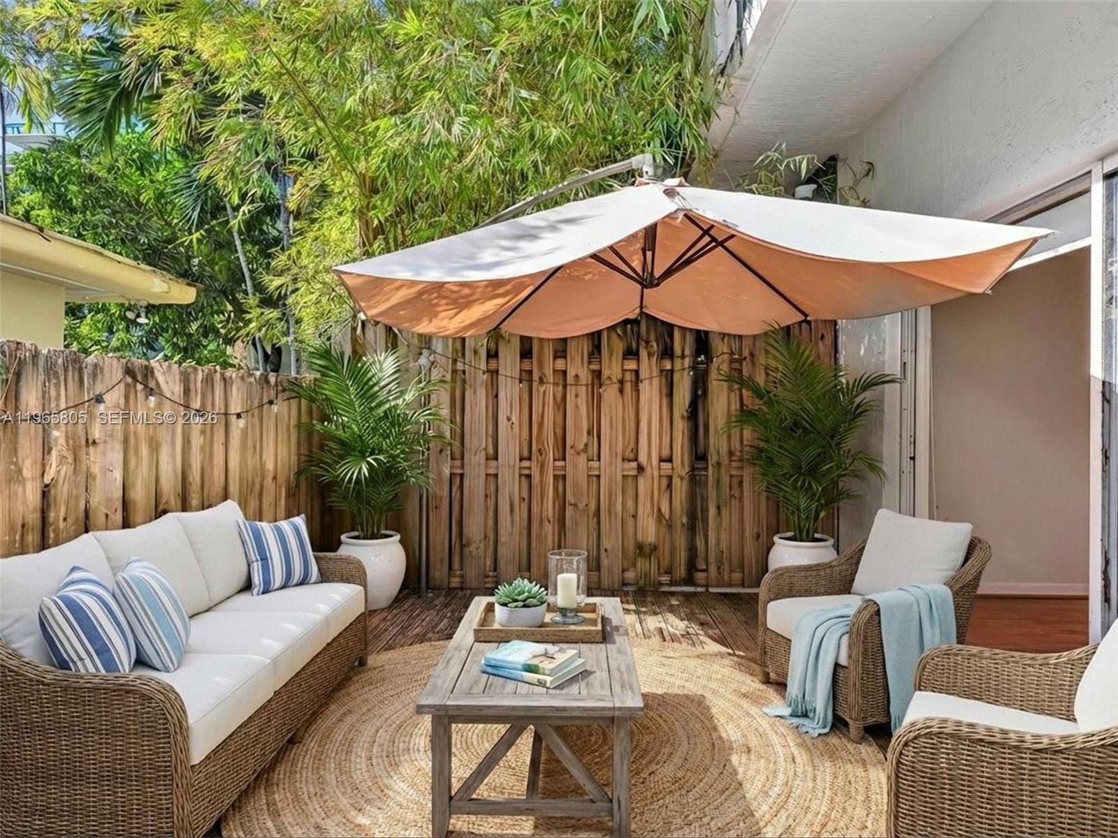 240 Southwest 15th Road, Unit 112 Miami, FL 33129 - Photo 2 of 47 a patio with patio a couch and chairs