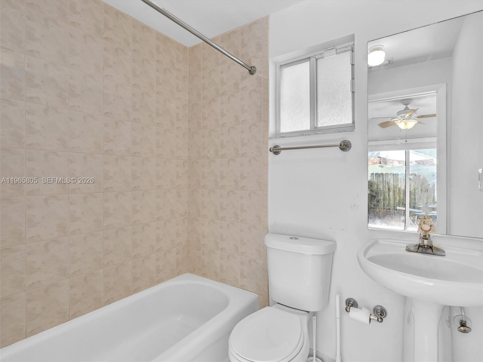 240 Southwest 15th Road, Unit 112 Miami, FL 33129 - Photo 21 of 47 a bathroom with a sink a toilet and shower