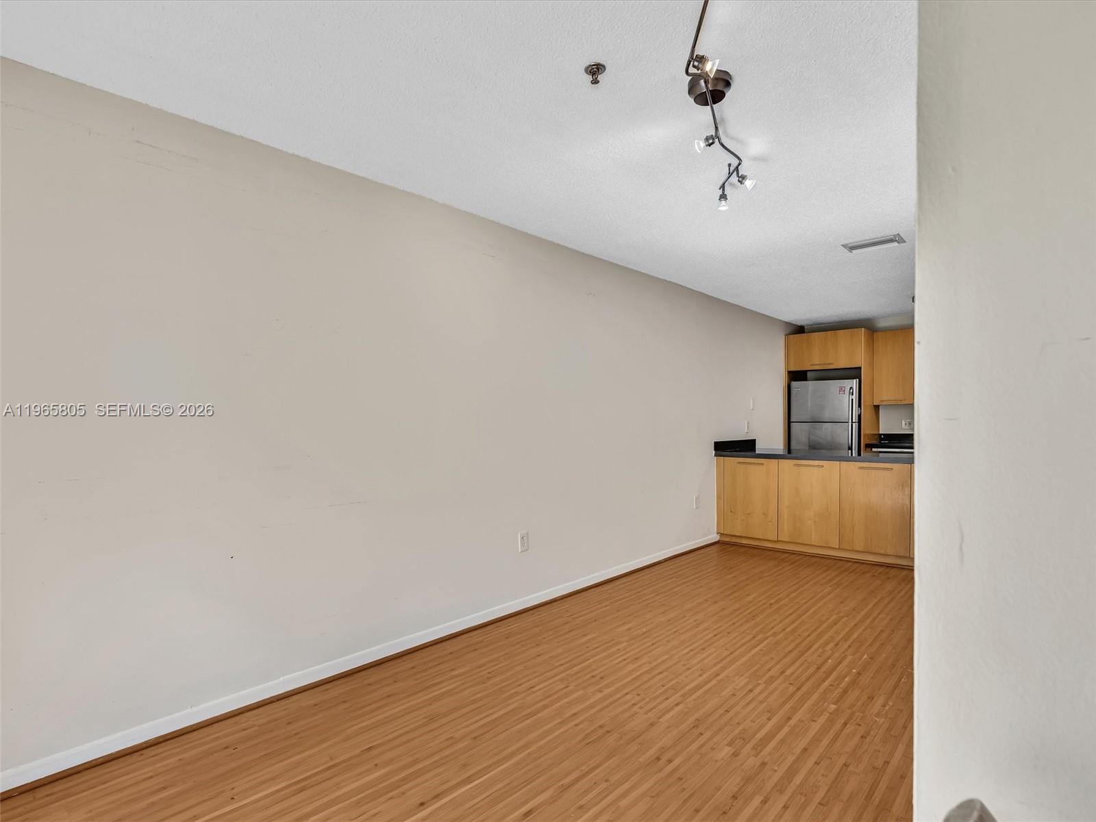 240 Southwest 15th Road, Unit 112 Miami, FL 33129 - Photo 22 of 47 a view of an empty room with wooden floor