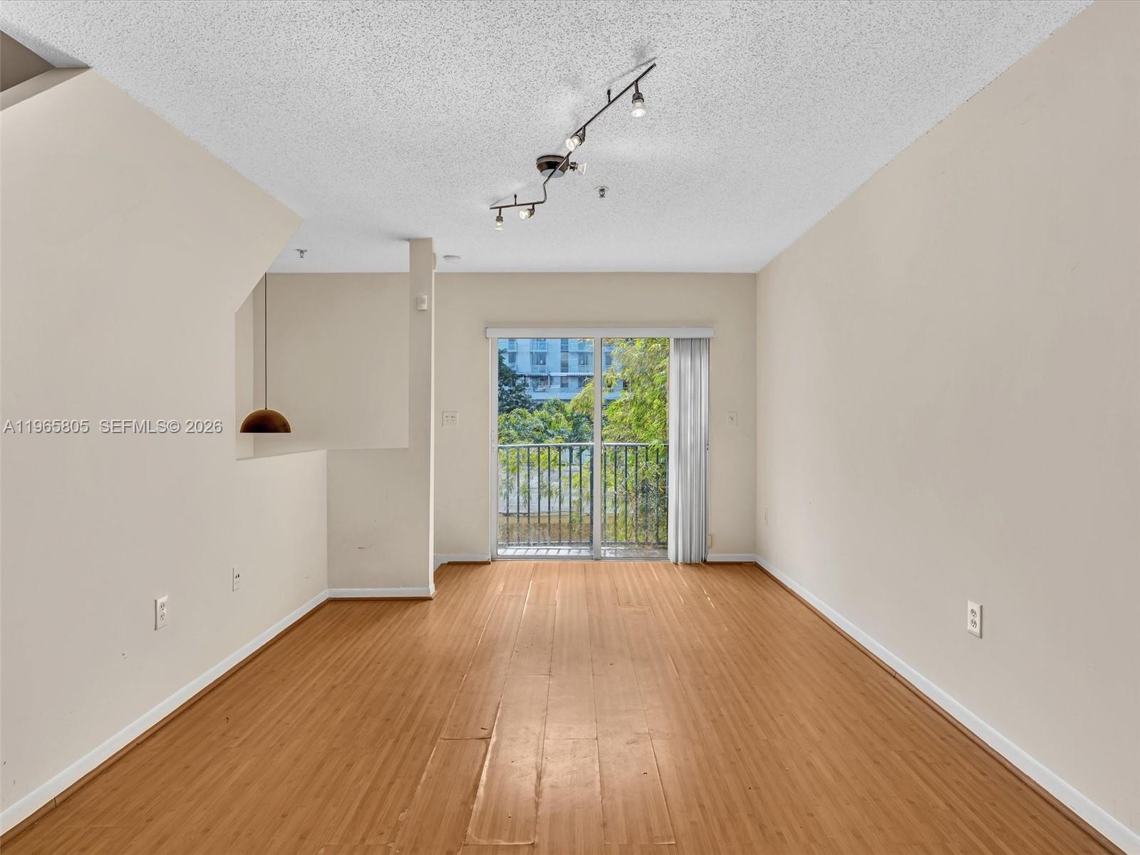240 Southwest 15th Road, Unit 112 Miami, FL 33129 - Photo 32 of 47 a view of a big room with wooden floor and windows