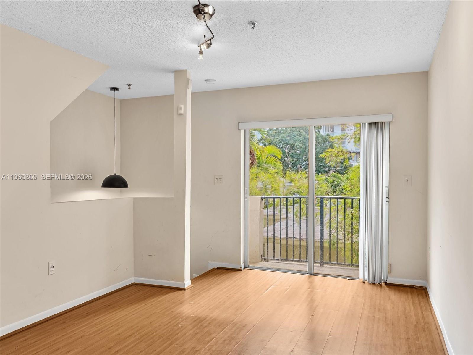 240 Southwest 15th Road, Unit 112 Miami, FL 33129 - Photo 33 of 47 a view of a room with wooden floor and windows