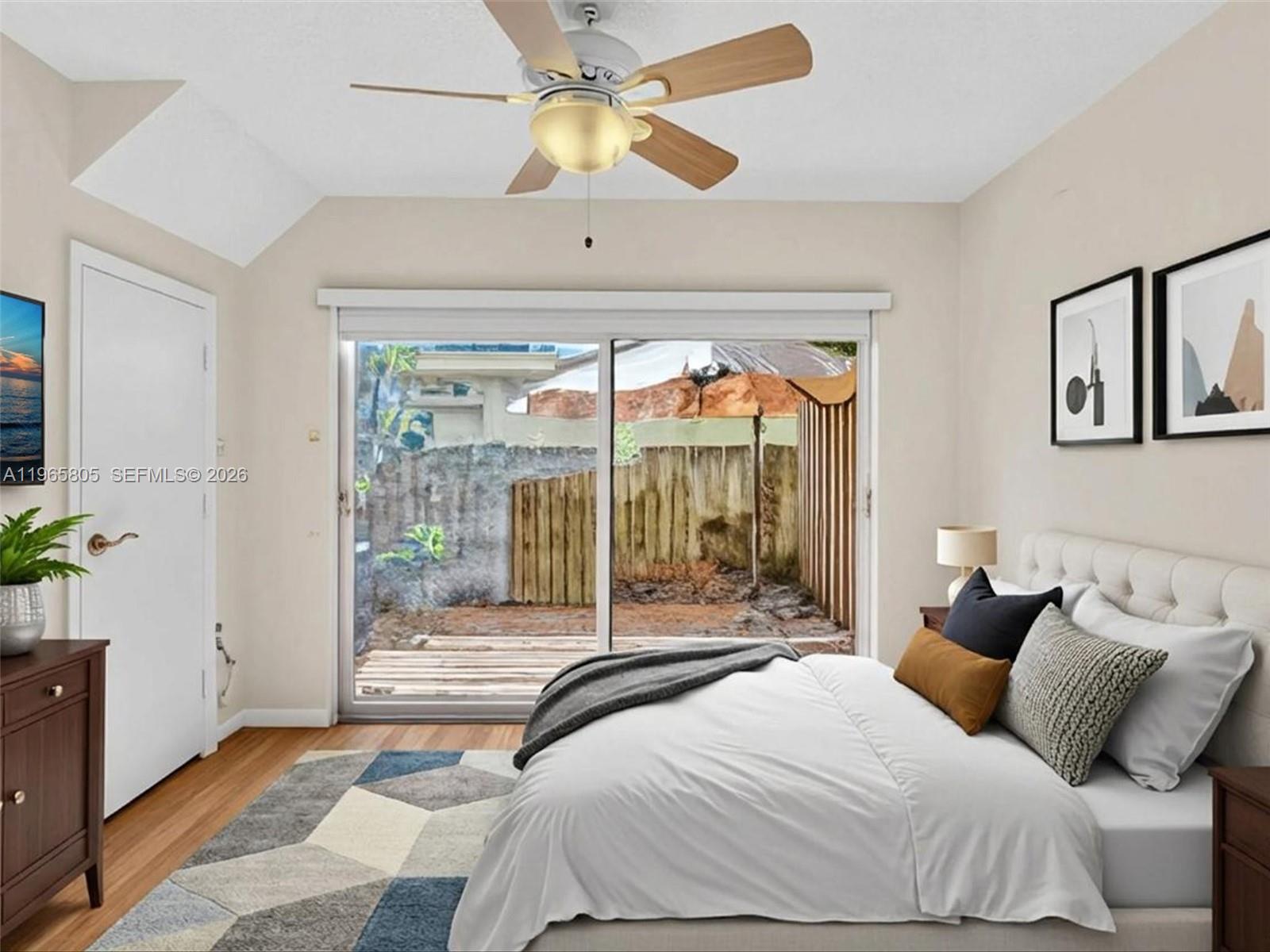 240 Southwest 15th Road, Unit 112 Miami, FL 33129 - Photo 7 of 47 a bedroom with a bed and a large window