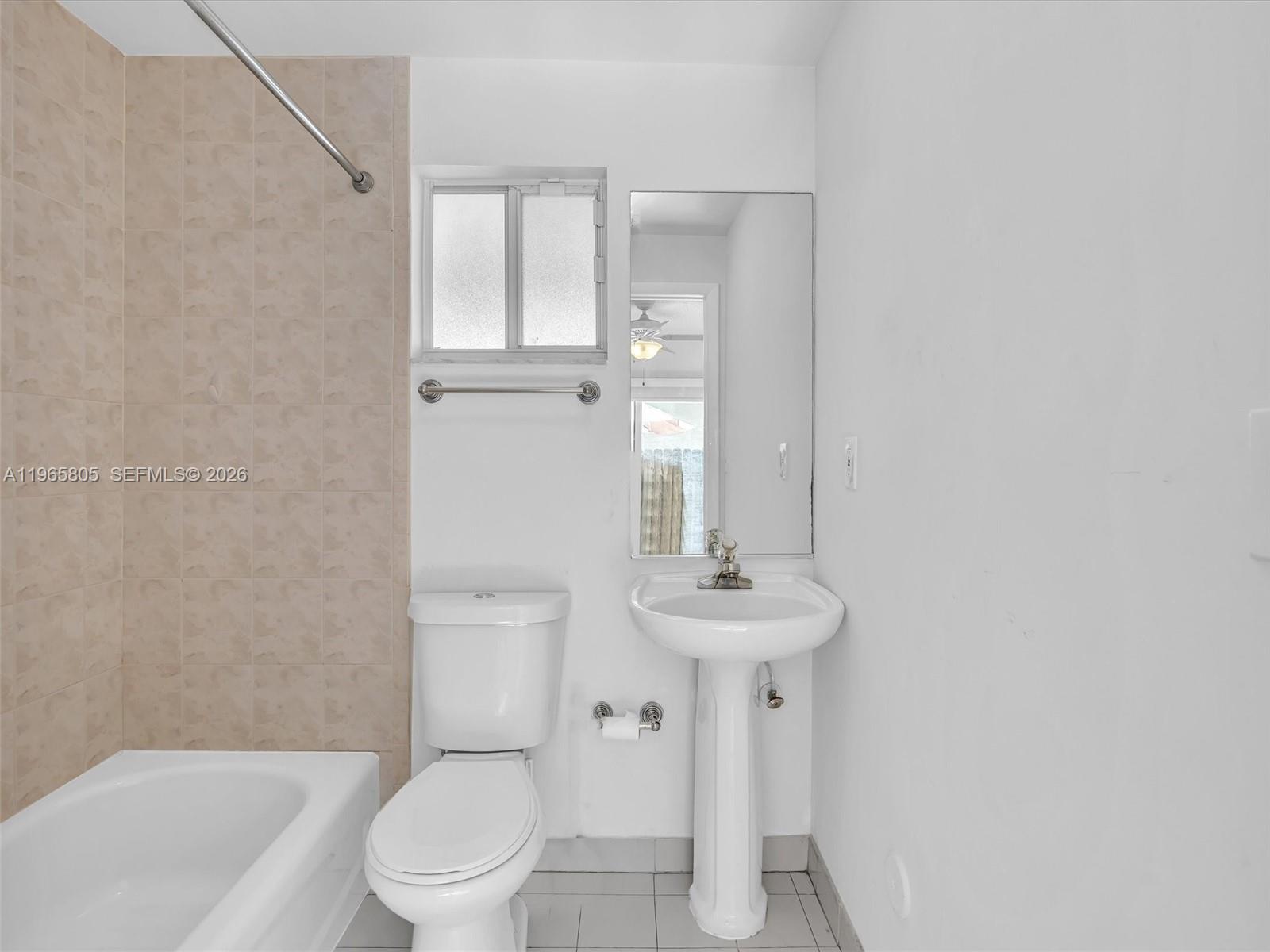 240 Southwest 15th Road, Unit 112 Miami, FL 33129 - Photo 8 of 47 a bathroom with a sink a toilet and shower