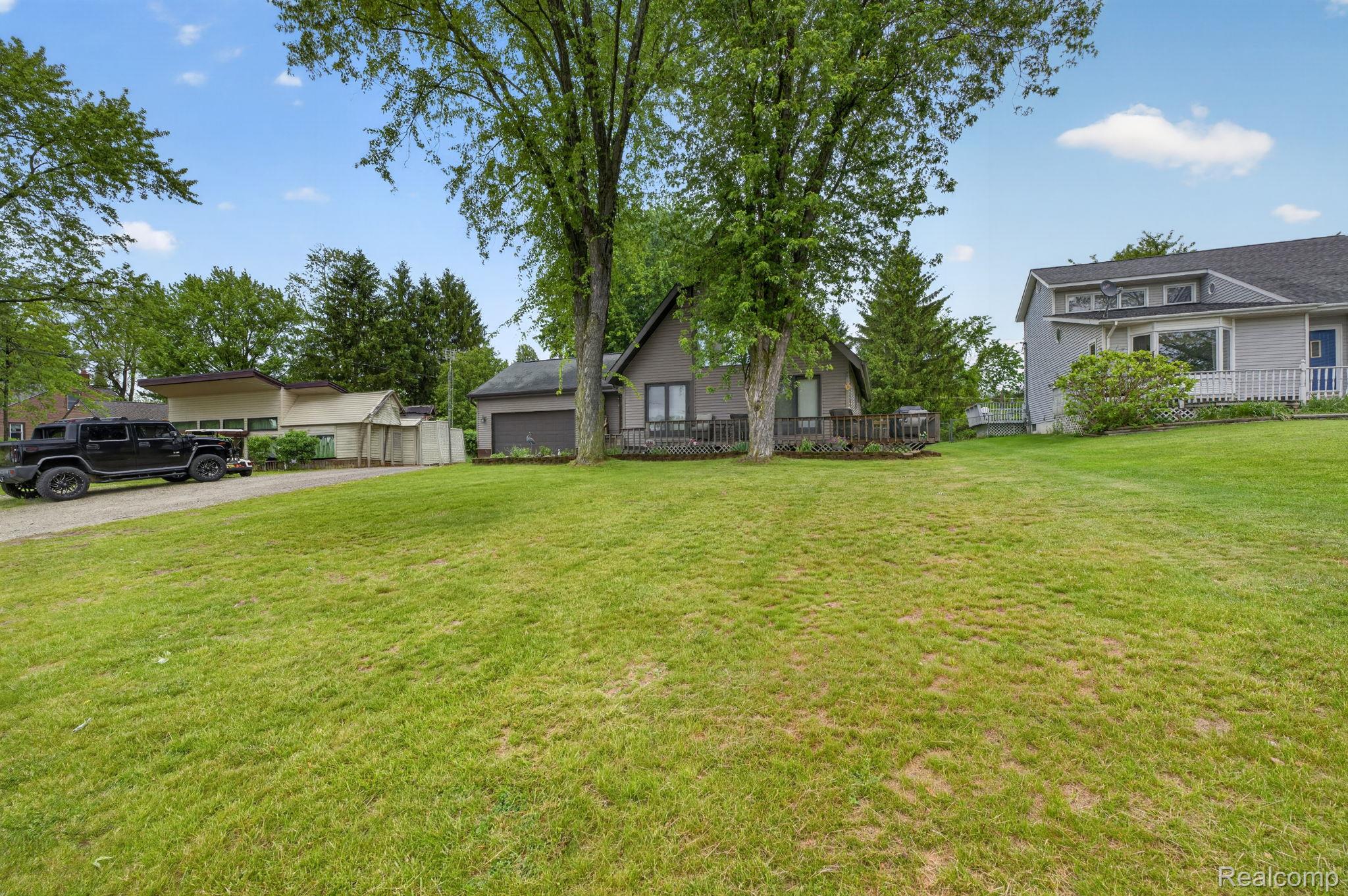 1280 Petts Road Fenton, MI 48430 - Photo 37 of 62 View of front facade with a garage and driveway