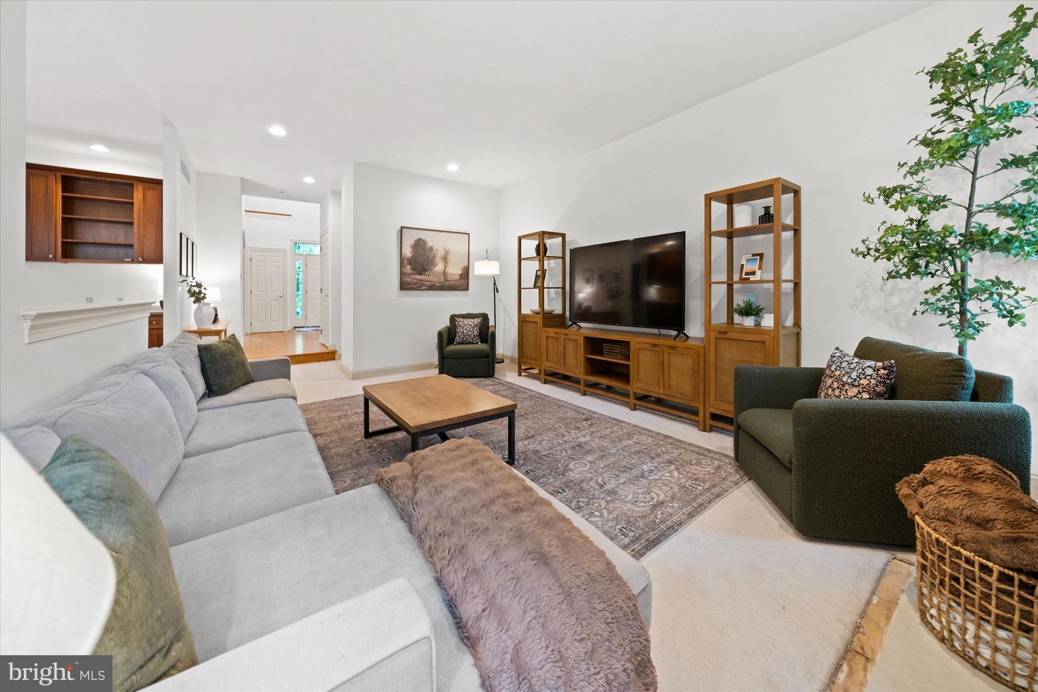 1618 Snuff Mill Road Hockessin, DE 19707 - Photo 11 of 48 a living room with furniture and a flat screen tv