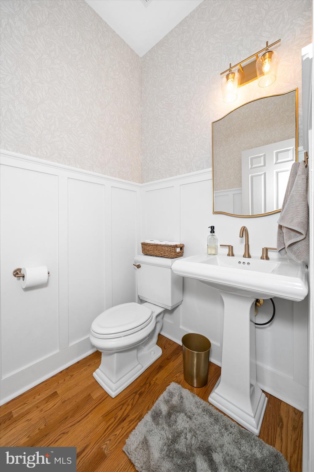 1618 Snuff Mill Road Hockessin, DE 19707 - Photo 18 of 48 a bathroom with a toilet sink and mirror