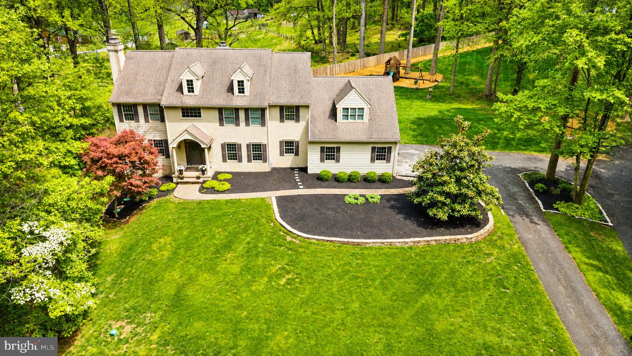 1618 Snuff Mill Road Hockessin, DE 19707 - Photo 2 of 48 a aerial view of a house with swimming pool garden and patio