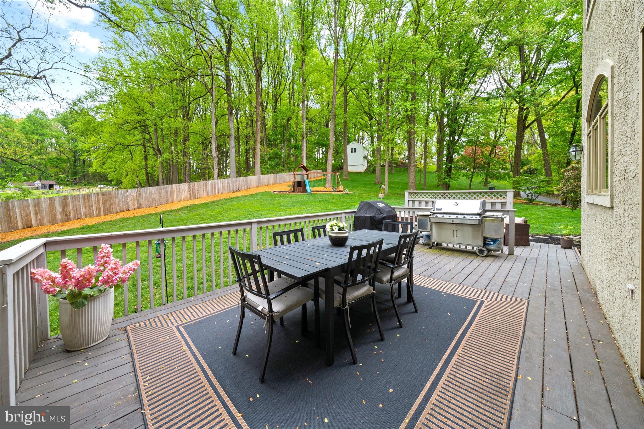 1618 Snuff Mill Road Hockessin, DE 19707 - Photo 40 of 48 a view of a chairs and table on the wooden deck