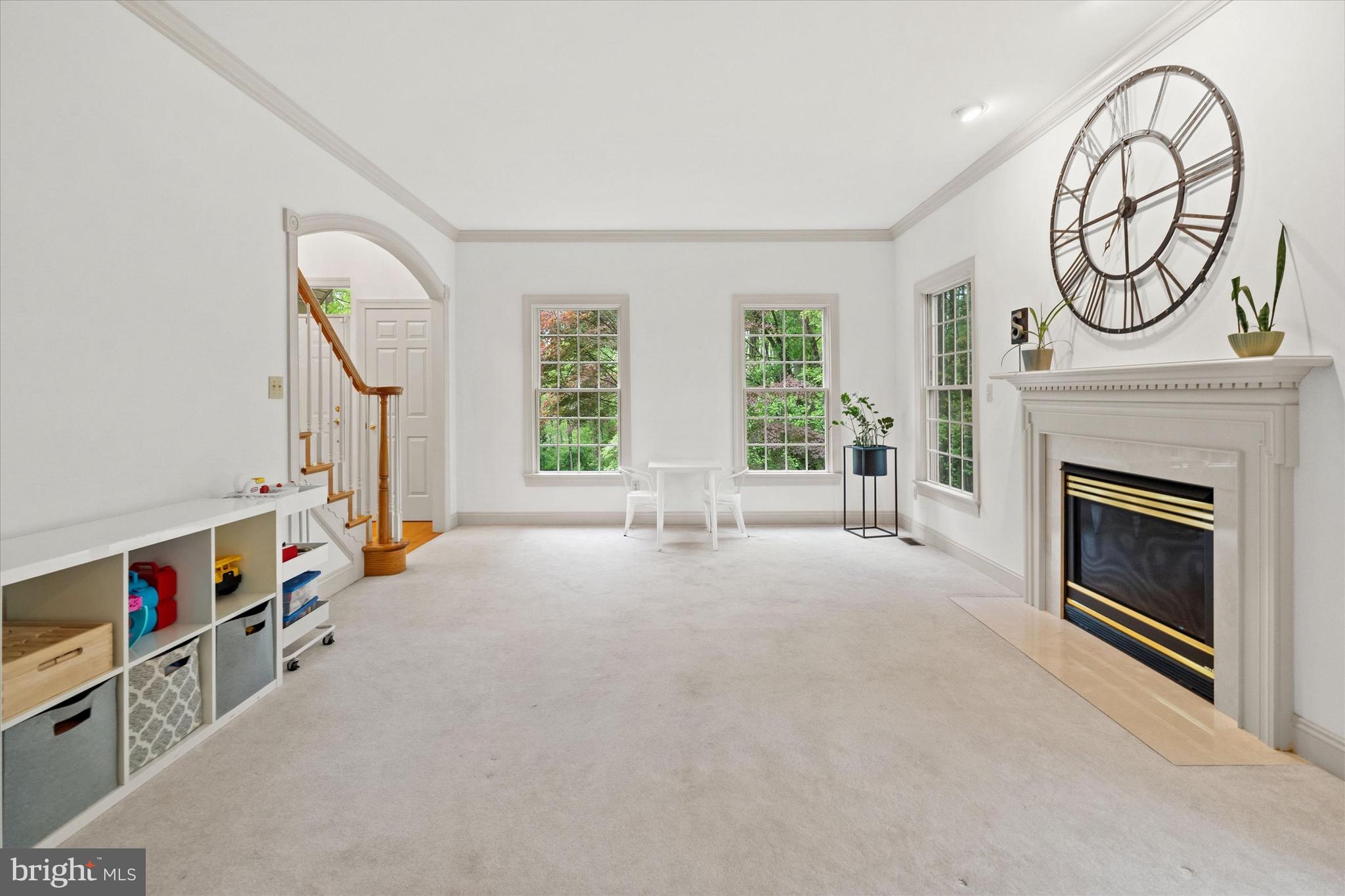 1618 Snuff Mill Road Hockessin, DE 19707 - Photo 9 of 48 a view of an empty room with stairs and a fireplace