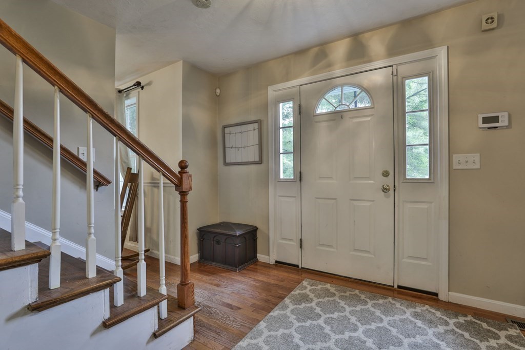 10 Castle Hill Road Windham, NH 03087 - Photo 3 of 35 a view of an entryway with wooden floor